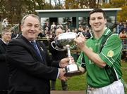 22 October 2006; Leinster captain Colin Moran is presented with the M Donnelly Interprovincial cup by Nickey Brennan, President of the GAA. M Donnelly Interprovincial Football Final, Leinster v Connacht, Irish Cultural Centre, Canton, Boston, USA. Picture credit: Brendan Moran / SPORTSFILE