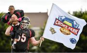 14 August 2014; Ahead of the Croke Park Classic on August 30th, the Dublin Rebels gave an American Football demonstration to kids taking part in the Kilmacud Crokes GAA Camp. The American College football game will see the University of Central Florida (UCF) take on Penn State in what is set to be an unmissable spectacle for all the family to enjoy. A full day’s entertainment schedule is planned in Croke Park that will feature parachute jumps, the Penn State marching band, Extreme Rhythm drumming group, The Dublin Gospel Choir, cheerleaders, team mascots and the Super 11’s. There is an amazing €50 August Family Ticket Offer (2 Adults and 2 Children) available for the event from www.crokeparkclassic.ie. Pictured during an American football demonstration at Kilmacud Crokes GAA Camp is Clara Corincan, aged 7, from Deansgrange, Dublin, and Steven Walsh, from Rathfarnham, Dublin. Kilmacud Crokes GAA Club, Stillorgan, Co. Dublin. Picture credit: Ramsey Cardy / SPORTSFILE