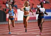 14 August 2014; Ireland's Kelly Proper, centre, crosses the line in fourth place during her heat of the women's 200m event, where she qualified for the semi-final with a time of 23.37. Also pictured are Martina Amidei of Italy, left, and Dina Asher-Smith of Great Britain. European Athletics Championships 2014 - Day 3. Letzigrund Stadium, Zurich, Switzerland. Picture credit: Stephen McCarthy / SPORTSFILE