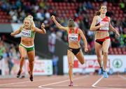 14 August 2014; Athletes, from left, Kelly Proper of Ireland, Inna Eftimova of Bulgaria and Lea Sprunger of Switzerland cross the finish line during their semi-final of the women's 200m event. European Athletics Championships 2014 - Day 3. Letzigrund Stadium, Zurich, Switzerland. Picture credit: Stephen McCarthy / SPORTSFILE