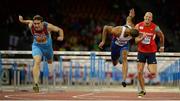 14 August 2014; Konstantin Shabanov of Russia, left, crosses the line to win the men's 110m hurdles final, from second place William Sharman of Great Britain, centre, and seventh place Artur Noga of Poland, right. European Athletics Championships 2014 - Day 3. Letzigrund Stadium, Zurich, Switzerland. Picture credit: Stephen McCarthy / SPORTSFILE