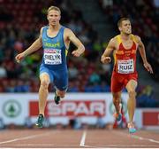 14 August 2014; Serhiy Smelyk of Ukraine crosses the line to take second in his semi-final of the men's 200m event. Also pictured is Sergio Ruiz of Spain. European Athletics Championships 2014 - Day 3. Letzigrund Stadium, Zurich, Switzerland. Picture credit: Stephen McCarthy / SPORTSFILE