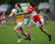 22 October 2006; Gemma Begley, Carrickmore, is tackled by Fiona Courtney, Donaghmoyne. Vhi Healthcare Ladies Ulster Senior Club Football Final, Carrickmore, Tyrone, v Donaghmoyne, Monaghan. Fintona, Co. Tyrone. Picture credit: Oliver McVeigh / SPORTSFILE