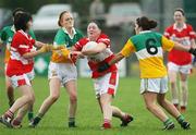 22 October 2006; Majella Woods, Donaghmoyne, in action against Claire O'Kane and Connie Fox, Carrickmore. Vhi Healthcare Ladies Ulster Senior Club Football Final, Carrickmore, Tyrone, v Donaghmoyne, Monaghan. Fintona, Co. Tyrone. Picture credit: Oliver McVeigh / SPORTSFILE
