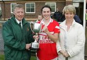 22 October 2006; The Donaghmoyne captain Fiona Courtney receives the Senior cup from Joe Lagan, Ulster Ladies GAA president, and Kathleen Cahill, Vhi Healthcare. Vhi Healthcare Ladies Ulster Senior Club Football Final, Carrickmore, Tyrone, v Donaghmoyne, Monaghan. Fintona, Co. Tyrone. Picture credit: Oliver McVeigh / SPORTSFILE