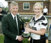 22 October 2006; Ulster Ladies GAA president Joe Langan presents Patricia McKenna, Emyvale, with the Junior cup. Vhi Healthcare Ladies Ulster Junior Club Football Final, Lissummon, Armagh, v Emyvale, Monaghan, Fintona, Co. Tyrone. Picture credit: Oliver McVeigh / SPORTSFILE