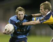 26 October 2006; Craig Rogers, UCD, is tackled by Nicky McGrath, Kilmacud Crokes. Dublin Senior Football Championship Semi-Final, UCD v Kilmacud Crokes, Parnell Park, Dublin. Picture credit: David Maher / SPORTSFILE