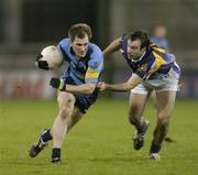 26 October 2006; Martin Dunne, UCD, is tackled by Conor Murphy, Kilmacud Crokes. Dublin Senior Football Championship Semi-Final, UCD v Kilmacud Crokes, Parnell Park, Dublin. Picture credit: David Maher / SPORTSFILE