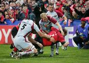 28 October 2006; Frankie Sheahan, Munster, scores try past Mike Prendergast and Bryce Williams, Bourgoin. Heineken Cup 2006-2007, Pool 4, Round 2, Munster v Bourgoin, Thomond Park, Limerick. Picture credit: Kieran Clancy / SPORTSFILE