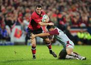 28 October 2006; Ian Dowling, Munster, is tackled by Guillaume Bousses, Bourgoin. Heineken Cup 2006-2007, Pool 4, Round 2, Munster v Bourgoin, Thomond Park, Limerick. Picture credit: Kieran Clancy / SPORTSFILE