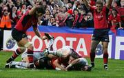 28 October 2006; Ian Dowling, Munster, scores a try against Bourgoin as Donnacha O'Callaghan and Shaun Payne celebrate. Heineken Cup 2006-2007, Pool 4, Round 2, Munster v Bourgoin, Thomond Park, Limerick. Picture credit: Kieran Clancy / SPORTSFILE