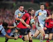 28 October 2006; John Kelly, Munster, is tackled by Sebastien Laloo and Benoit Cabello, Bourgoin. Heineken Cup 2006-2007, Pool 4, Round 2, Munster v Bourgoin, Thomond Park, Limerick. Picture credit: Kieran Clancy / SPORTSFILE