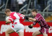 29 October 2006: Stephen Hickey, Eire Og, in action against Cathal Hill, Lissycasey. Clare Senior Football Championship Final, Eire Og v Lissycasey, Cusack Park, Ennis, Co. Clare. Picture credit: Kieran Clancy / SPORTSFILE