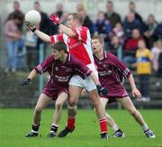 29 October 2006: Stephen Hickey, Eire Og, in action against Cathal Hill and James Kelly, Lissycasey. Clare Senior Football Championship Final, Eire Og v Lissycasey, Cusack Park, Ennis, Co. Clare. Picture credit: Kieran Clancy / SPORTSFILE