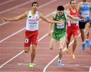 15 August 2014; Ireland's Mark English crosses the line to finish in third place and win a bronze medal in the men's 800m event, with a season best time of 1:45.03. Also pictured is Artur Kuciapski of Poland who won silver. European Athletics Championships 2014 - Day 4. Letzigrund Stadium, Zurich, Switzerland. Picture credit: Stephen McCarthy / SPORTSFILE