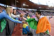15 August 2014; Ireland's Mark English is congratulated by spectators after winning bronze in the men's 800m event, with a season best time of 1:45.03. European Athletics Championships 2014 - Day 4. Letzigrund Stadium, Zurich, Switzerland. Picture credit: Stephen McCarthy / SPORTSFILE