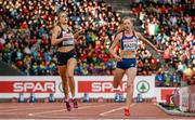 15 August 2014; Marie Gayot of France, left, and Bianca Razor of Romania, right, cross the finish line during the final of the women's 400m final. European Athletics Championships 2014 - Day 4. Letzigrund Stadium, Zurich, Switzerland. Picture credit: Stephen McCarthy / SPORTSFILE