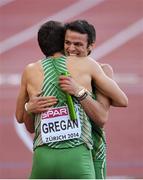 16 August 2014; Thomas Barr who ran the anchor leg for Ireland celebrates with Brian Gregan following their 4x400m qualifying heat. The team, which also includes Brian Murphy and Richard Morrissey, finished third and qualified for tomorrow's final, in a new national record time of 3:03.57. European Athletics Championships 2014 - Day 5. Letzigrund Stadium, Zurich, Switzerland. Picture credit: Stephen McCarthy / SPORTSFILE