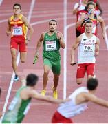 16 August 2014; Richard Morrissey running the second last leg looks to change over with Thomas Barr for Ireland during their 4x400m qualifying heat. The team, which finished third and qualified for tomorrow's final, in a new national record time of 3:03.57, also included Brian Gregan and Brian Murphy. European Athletics Championships 2014 - Day 5. Letzigrund Stadium, Zurich, Switzerland. Picture credit: Stephen McCarthy / SPORTSFILE