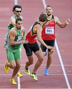16 August 2014; Richard Morrissey running the second last leg take the baton from Brian Murphy for Ireland during their 4x400m qualifying heat. The team, which finished third and qualified for tomorrow's final, in a new national record time of 3:03.57, also included Brian Gregan and Thomas Barr. European Athletics Championships 2014 - Day 5. Letzigrund Stadium, Zurich, Switzerland. Picture credit: Stephen McCarthy / SPORTSFILE