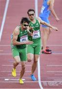 16 August 2014; Brian Murphy running the second leg takes the baton from Brian Gregan for Ireland during their 4x400m qualifying heat. The team, which finished third and qualified for tomorrow's final, in a new national record time of 3:03.57, also included Richard Morrissey and Thomas Barr. European Athletics Championships 2014 - Day 5. Letzigrund Stadium, Zurich, Switzerland. Picture credit: Stephen McCarthy / SPORTSFILE