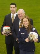 27 October 2006; The National Standards Authority (NSAI) launched a new standard, I.S. 355, of helmets for hurlers and camogie players at Erin's Own GAA Club, Cork. Requirements will have to be met at all levels concerning construction of the helmet including shock absorption, sliothar and hurley impact. All hurlers under the age of 21 and all camogie players under the age og 18 are required to wear a helmet when playing. Pictured at the launch are, from left, Cork hurler Ronan Curran, Dan Tierney, Chairman, NSAI, and Cork camogie captain Joanne O'Callaghan. Erin's Own GAA Club, Pairc Ui Chonaill, Cork. Picture credit: Brendan Moran / SPORTSFILE