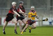 29 October 2006; Stephen McDonnell, Craobh Chiarain, in action against Thomas Murphy and Padraig Nolan (far left), Mount Leinster Rangers. AIB Leinster Senior Club Hurling Championship First Round, Craobh Chiarain v Mount Leinster Rangers, Parnell Park, Dublin. Picture credit: Ray Lohan / SPORTSFILE