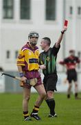 29 October 2006; Referee James McGrath shows David Wyse, Craobh Chiarain, the red card. Mount Leinster Rangers. AIB Leinster Senior Club Hurling Championship First Round, Craobh Chiarain v Mount Leinster Rangers, Parnell Park, Dublin. Picture credit: Ray Lohan / SPORTSFILE
