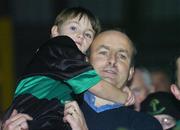 29 October 2006; Nemo Rangers, fan Micheal Martin T.D. Minist four Enterprise with his son Kilean after the win against Doheny's. Cork Senior Football Championship Final, Nemo Rangers v Doheny's, Pairc Ui Chaoimh, Cork. Picture credit: Matt Browne / SPORTSFILE