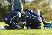 31 October 2006; Brian O'Driscoll has his ankle attended to by Dr. Gary O'Driscoll, team doctor, and Cameron Steele, team physio, right, during Ireland rugby squad training. St. Gerard's School, Bray, Co. Wicklow. Picture credit: Pat Murphy / SPORTSFILE
