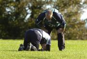 31 October 2006; Brian O'Driscoll lies injured as team massous Willie Bennett checks on his condition masseuse during Ireland rugby squad training. St. Gerard's School, Bray, Co. Wicklow. Picture credit: Pat Murphy / SPORTSFILE
