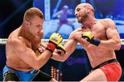 16 August 2014; Peter Queally, right, in action against Konrad Iwanowski during their welterweight bout. Cage Warriors 70 Fight Night, The Helix, Dublin. Picture credit: Ramsey Cardy / SPORTSFILE
