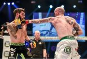 16 August 2014; Tommy McCafferty, right, in action against Dean Reilly during their featherweight bout. Cage Warriors 70 Fight Night, The Helix, Dublin. Picture credit: Ramsey Cardy / SPORTSFILE