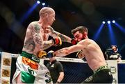 16 August 2014; Tommy McCafferty, left, in action against Dean Reilly during their featherweight bout. Cage Warriors 70 Fight Night, The Helix, Dublin. Picture credit: Ramsey Cardy / SPORTSFILE