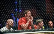 16 August 2014; Trainer John Kavanagh, centre, issues instructions to his fighter during a bout. Also pictured are UFC fighters Cathal Pendred, left, and Chris Fields. Cage Warriors 70 Fight Night, The Helix, Dublin. Picture credit: Ramsey Cardy / SPORTSFILE