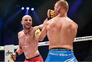 16 August 2014; Peter Queally, left, in action against Konrad Iwanowski during their welterweight bout. Cage Warriors 70 Fight Night, The Helix, Dublin. Picture credit: Ramsey Cardy / SPORTSFILE