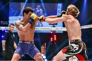 16 August 2014; Andy Young, right, in action against Paul Marin during their flyweight bout. Cage Warriors 70 Fight Night, The Helix, Dublin. Picture credit: Ramsey Cardy / SPORTSFILE
