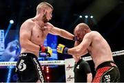16 August 2014; Karl Moore, left, in action against Lloyd Clarkson during their light-heavyweight bout. Cage Warriors 70 Fight Night, The Helix, Dublin. Picture credit: Ramsey Cardy / SPORTSFILE