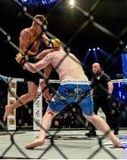 16 August 2014; Paul Redmond, right, in action against Alexis Savvidis during their lightweight bout. Cage Warriors 70 Fight Night, The Helix, Dublin. Picture credit: Ramsey Cardy / SPORTSFILE