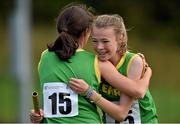 17 August 2014; Kerry's Fiona Doyle celebrates with team-mate Cara Daly, left, after winning the Girls' U14 Mixed Distance Cross Country Relay event. HSE Community Games August Festival 2014, Athlone Institute of Technology, Athlone, Co. Westmeath. Picture credit: Pat Murphy / SPORTSFILE