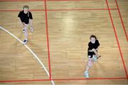 17 August 2014; Clodagh Cagney, left, and Aisling Leckey, from Naas, Co. Kildare, competing in the Girls U15 Badminton Final event. HSE Community Games August Festival 2014, Athlone Institute of Technology, Athlone, Co. Westmeath. Picture credit: Pat Murphy / SPORTSFILE