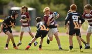 17 August 2014; Oscar O'Gorman, Doora Barefield, Co. Clare, is tackled by James Mooney, Ballinasloe, Co. Galway, during the Mini Rugby U11 Final event. HSE Community Games August Festival 2014, Athlone Institute of Technology, Athlone, Co. Westmeath. Picture credit: Pat Murphy / SPORTSFILE