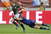 17 August 2014; Grace Davitt, Ireland, on her way to scoring her side's second try of the game, breaks though the tackle of Jessy Tremouliere, France. 2014 Women's Rugby World Cup 3rd / 4th place Play-off, Ireland v France. Stade Jean Bouin, Paris, France. Picture credit: Aurelien Meunier / SPORTSFILE