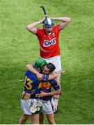 17 August 2014; A dejected Damien Cahalane, Cork, leaves the field, as Tipperary players, Noel McGrath, left, and Cathal Barrett, celebrate. GAA Hurling All-Ireland Senior Championship Semi-Final, Cork v Tipperary. Croke Park, Dublin. Picture credit: Dáire Brennan / SPORTSFILE