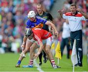 17 August 2014; Cork manager Jimmy Barry-Murphy looks on as Cork's Stephen McDonnell attempts to gain possession of the sliotar ahead of Patrick Maher, Tipperary. GAA Hurling All-Ireland Senior Championship Semi-Final, Cork v Tipperary. Croke Park, Dublin. Picture credit: Brendan Moran / SPORTSFILE