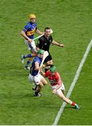 17 August 2014; Daniel Kearney, Cork, in action against Noel McGrath, right, and James Barry, Tipperary, with referee James Owens. GAA Hurling All-Ireland Senior Championship Semi-Final, Cork v Tipperary. Croke Park, Dublin. Picture credit: Dáire Brennan / SPORTSFILE