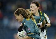 31 October 2006; Shelley Matcham, Australia, in action against Mairead Morrissey, Ireland. Ladies International Rules Series 2006, First Test, Ireland v Australia, Kingspan Breffni Park, Cavan. Picture credit: Brian Lawless / SPORTSFILE