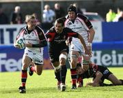 21 October 2006; Paddy Wallace, Ulster, supported by Justin Harrison gets away from Florian Fritz, Toulouse Heineken Cup 2006-2007, Pool 5, Round 1, Ulster v Toulouse, Ravenhill Park, Belfast. Picture credit: Oliver McVeigh / SPORTSFILE