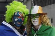 5 November 2006; Lana Roberts, left, Victoria, Australia, and Lorna Poole, Enniscorthy, Co. Wexford, Ireland, support a side each as they make their way to the game. Coca-Cola International Rules Series 2006, Second Test, Ireland v Australia, Croke Park, Dublin. Picture credit: Ray McManus / SPORTSFILE