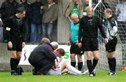 23 September 2006; Johnny Cowan, Armagh City, looks on as Colin Nixon, Glentoran, receives treatment from Glentoran's Dr Kyle. Carnegie Premier League, Armagh City v Glentoran, Holm Park, Armagh, Co. Armagh. Picture credit: Russell Pritchard / SPORTSFILE
